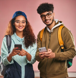 Firefly Indian college students, a boy & a girl, with mobile phones in hand 76927